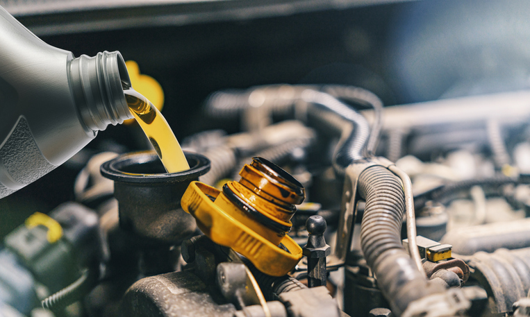 Oil change occurring on a car