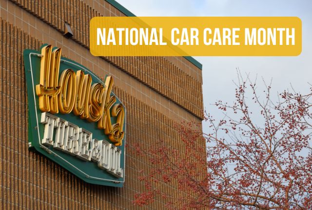 Houska Automotive sign on building. April is National Car Care Month.